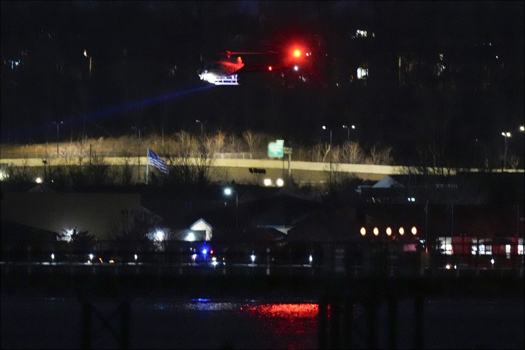 Passenger jet with 64 aboard collides with Army helicopter while landing at Reagan Airport near DC