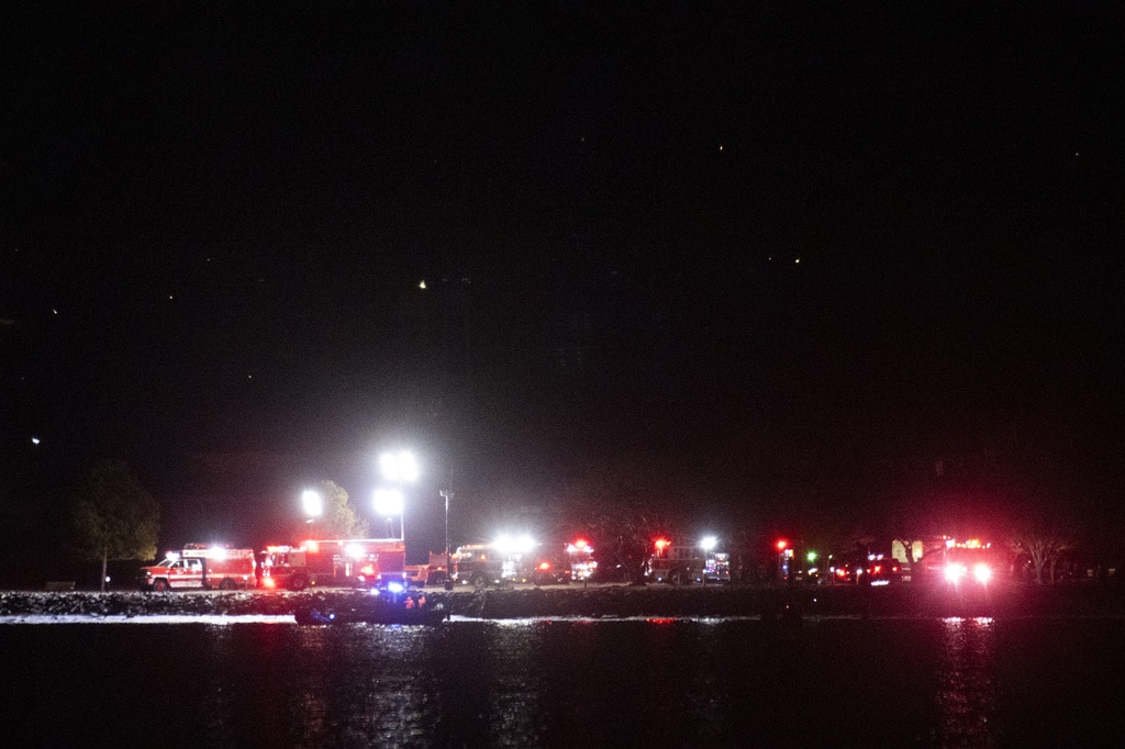 Passenger jet with 64 aboard collides with Army helicopter while landing at Reagan Airport near DC