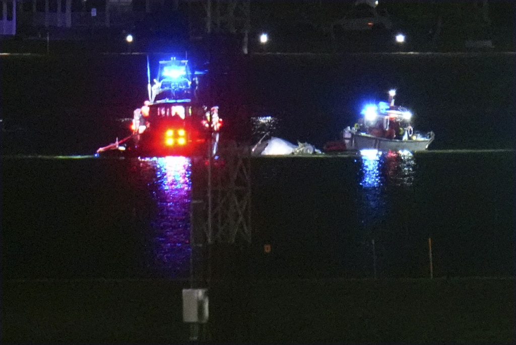 Passenger jet with 64 aboard collides with Army helicopter while landing at Reagan Airport near DC