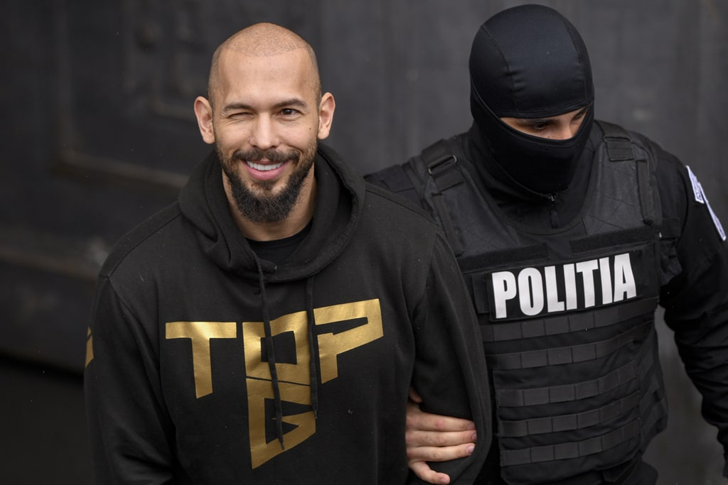 Influencer Tate brothers, who face human trafficking charges, arrive in the US