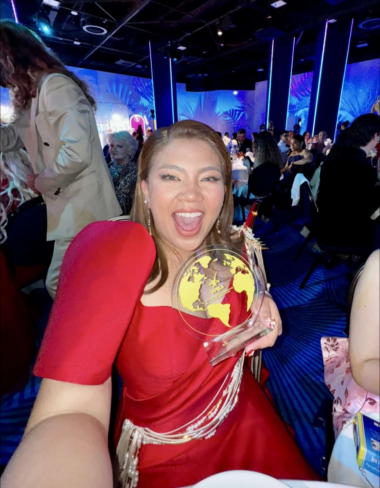 Abi Marquez holding her trophy after winning the world's best food blogger on the eve of Festival de Cannes gala.