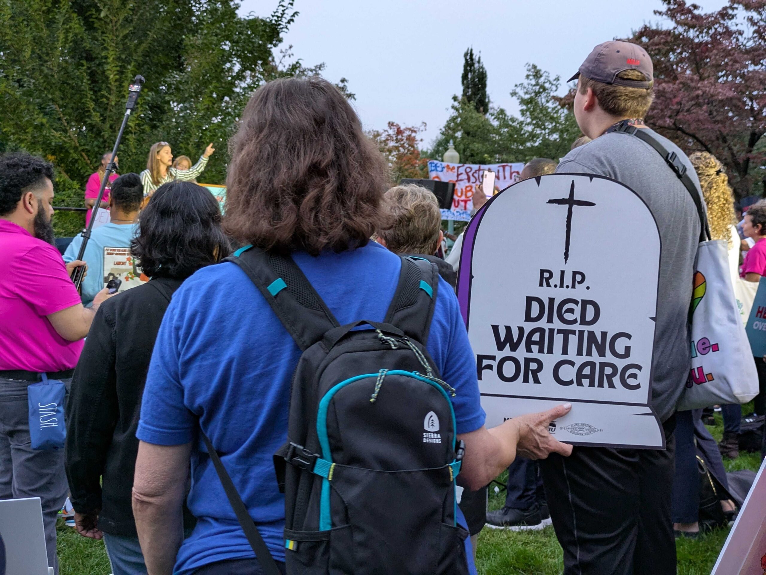 An advocate holds an SEIU sign protesting rising health care costs at a demonstration near the U.S. Capitol on Tuesday, Sept. 30, 2025. (Photo by Ashley Murray/States Newsroom)